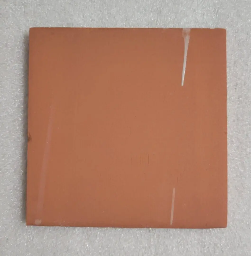 Closed brown notebook with a pen holder on the right edge.