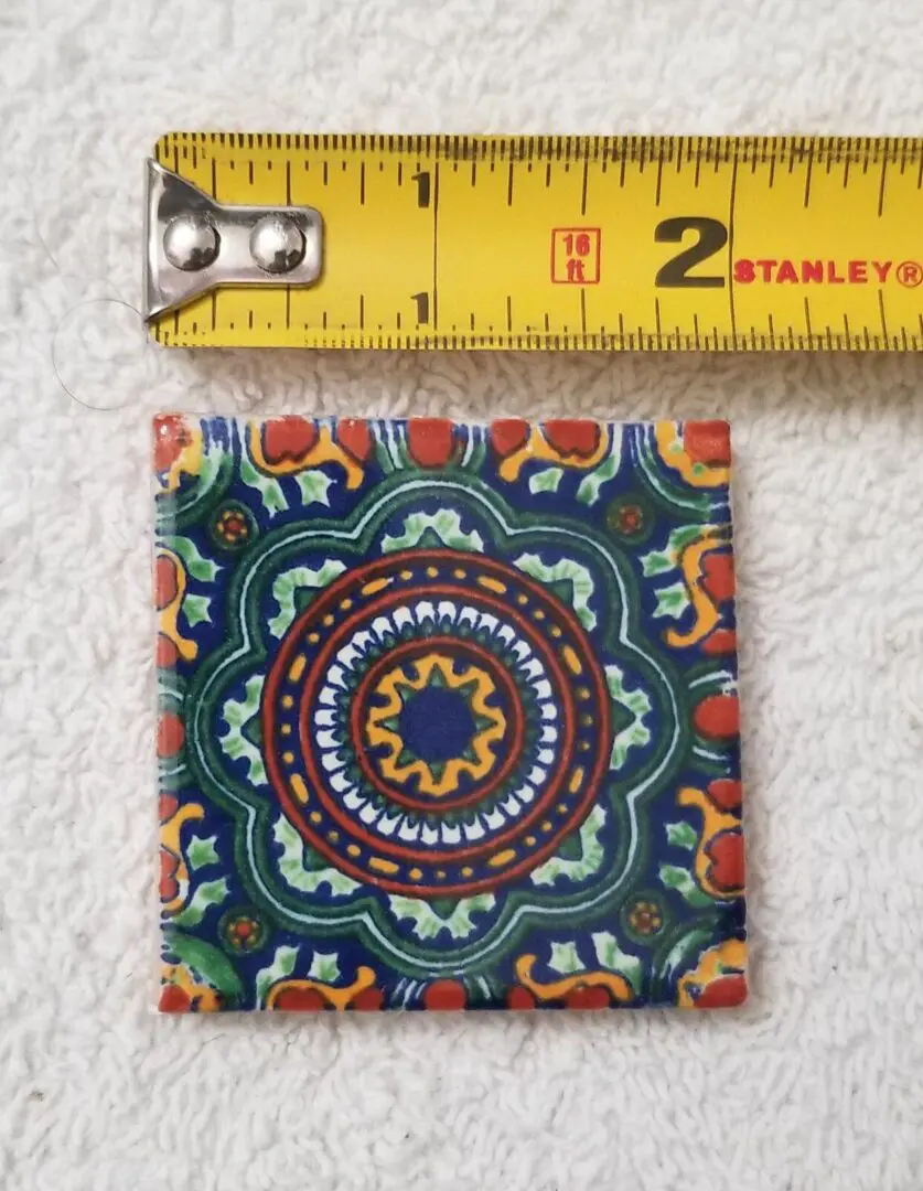 Decorative tile with vibrant geometric pattern.