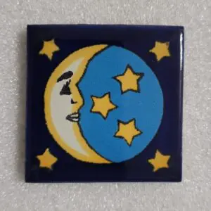 Tile with a crescent moon and stars design.
