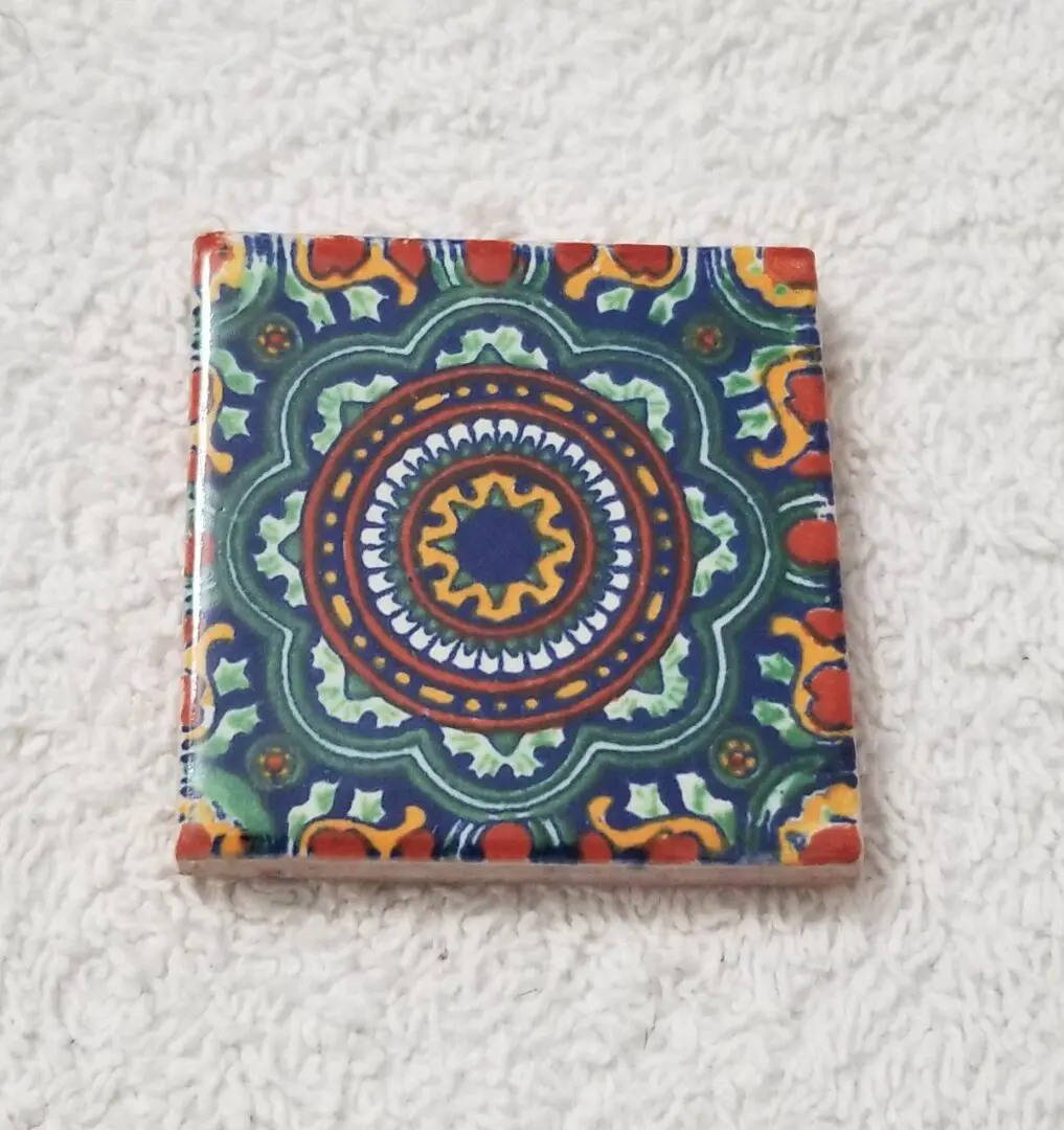 Square ceramic tile with colorful mandala pattern