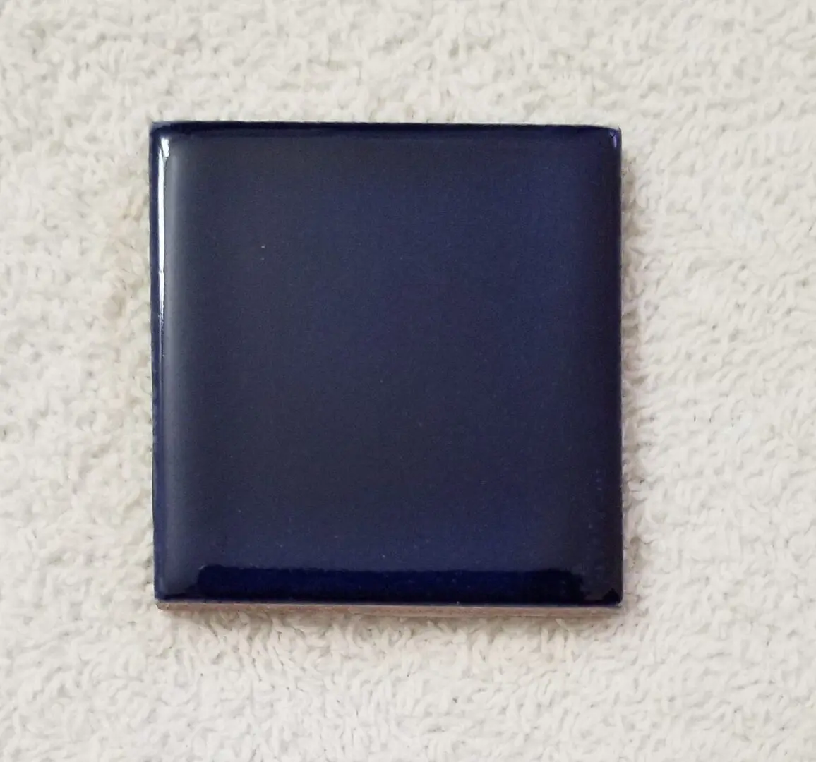 Glossy dark blue square ceramic tile