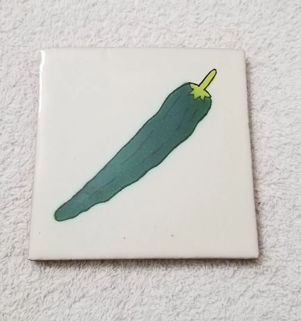 Drawing of a cucumber on tile.