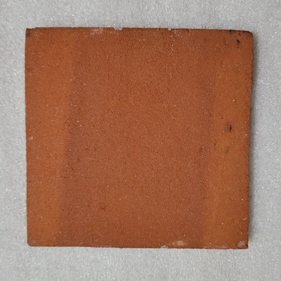 Unglazed square terracotta floor tile