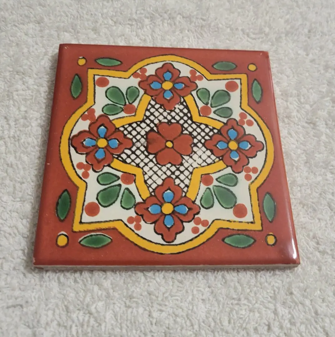 Colorful square ceramic tile with floral motif