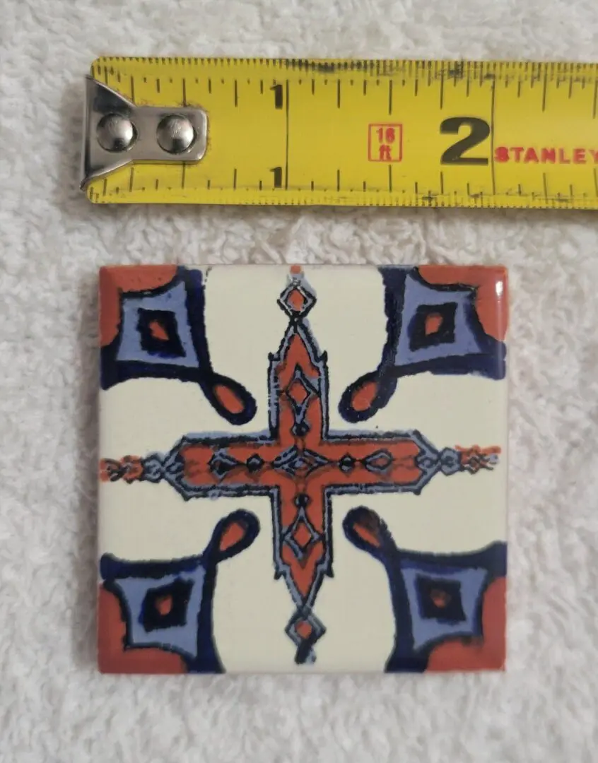 Colorful ceramic tile with geometric cross design