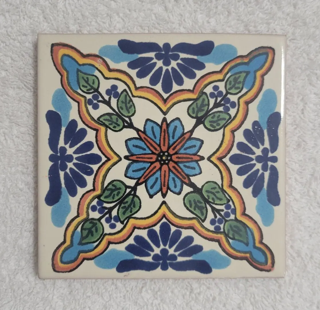 Decorative blue and green floral ceramic tile