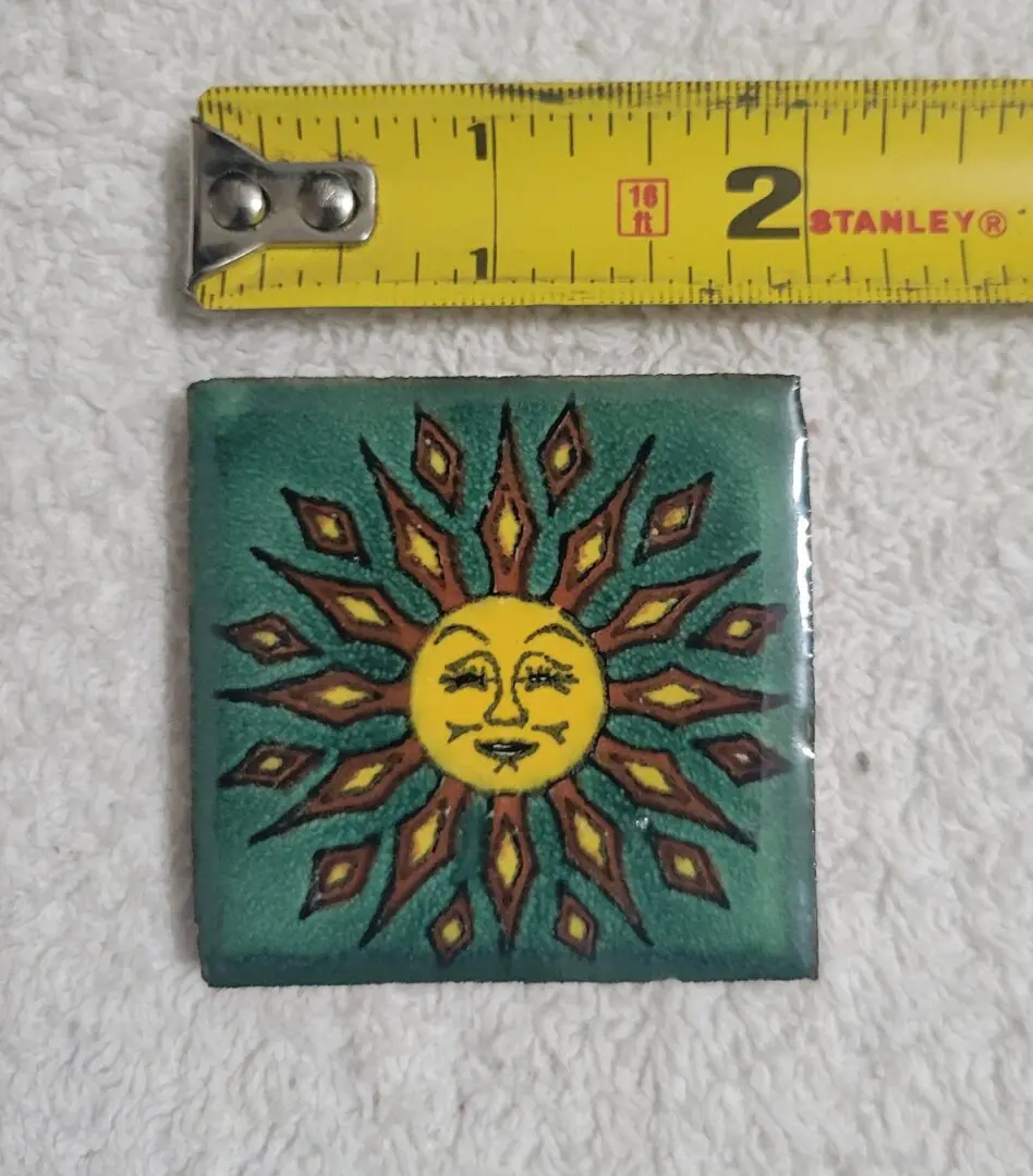 Sun tile with tape measure above.