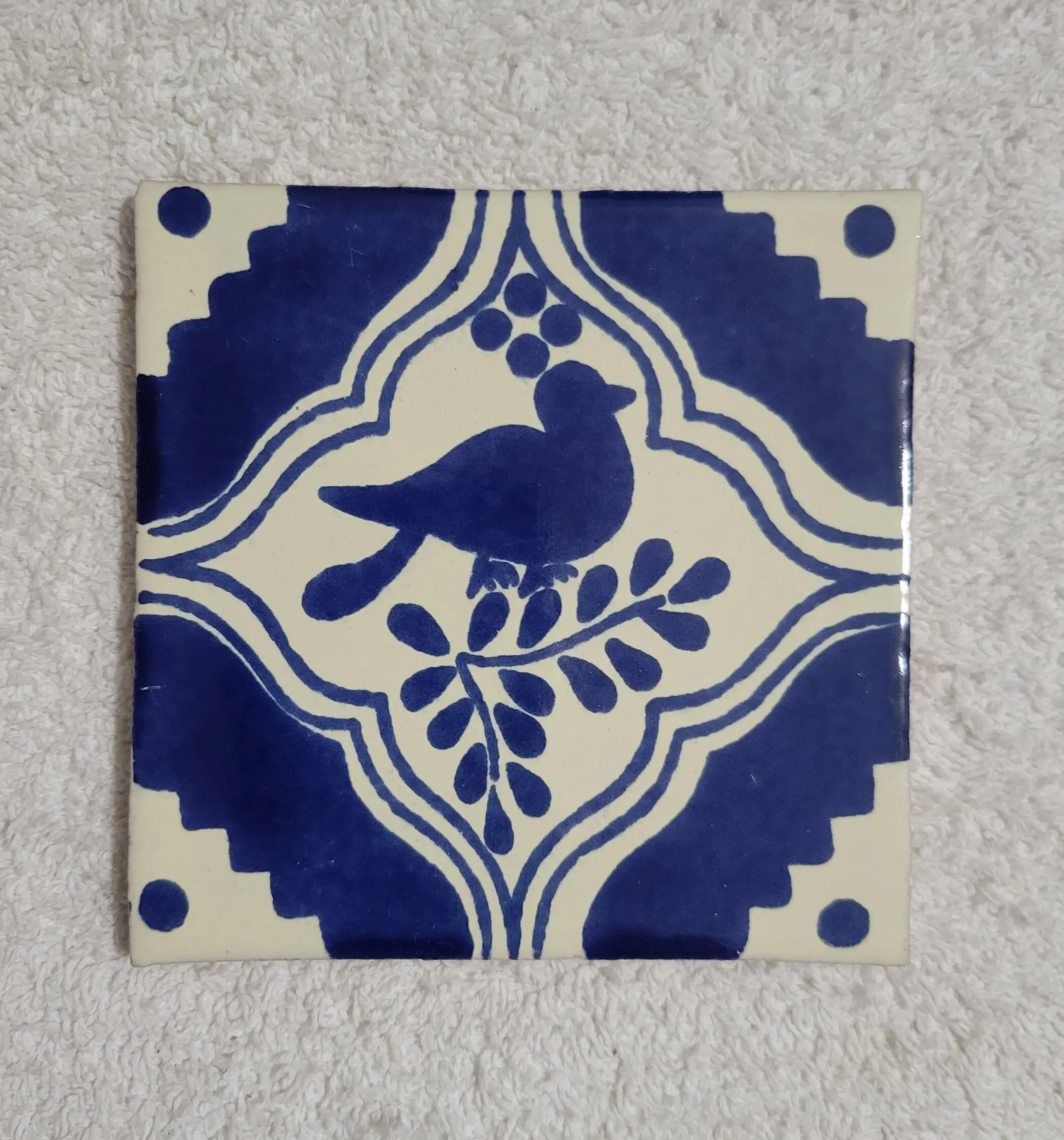 Ornamental blue bird ceramic tile