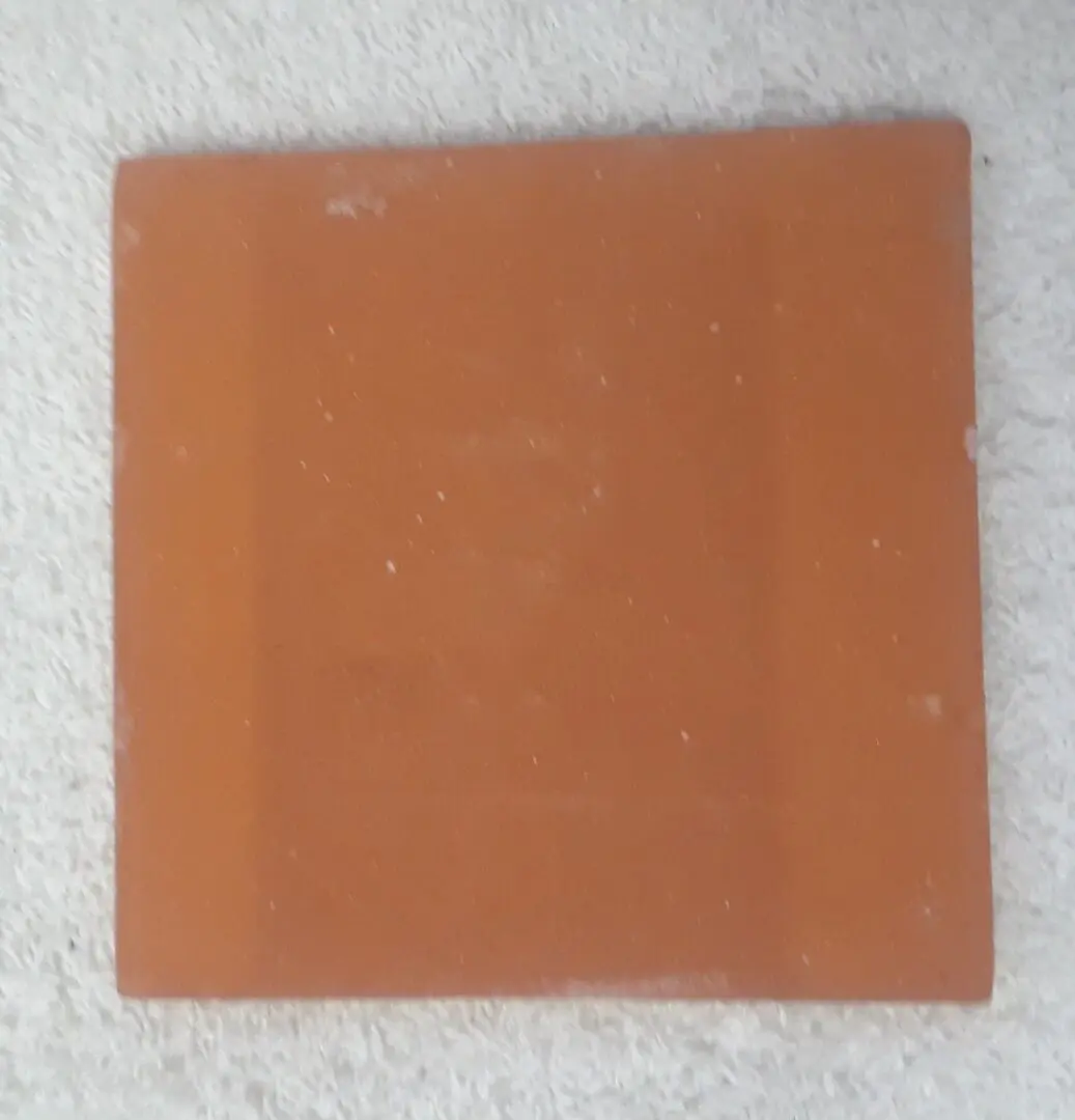 A square copper-clad board with a smooth surface.