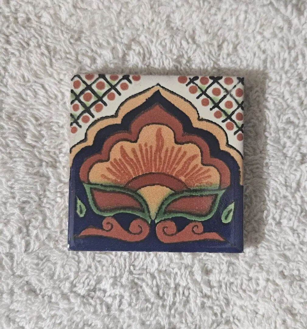 Colorful floral ceramic tile with geometric border