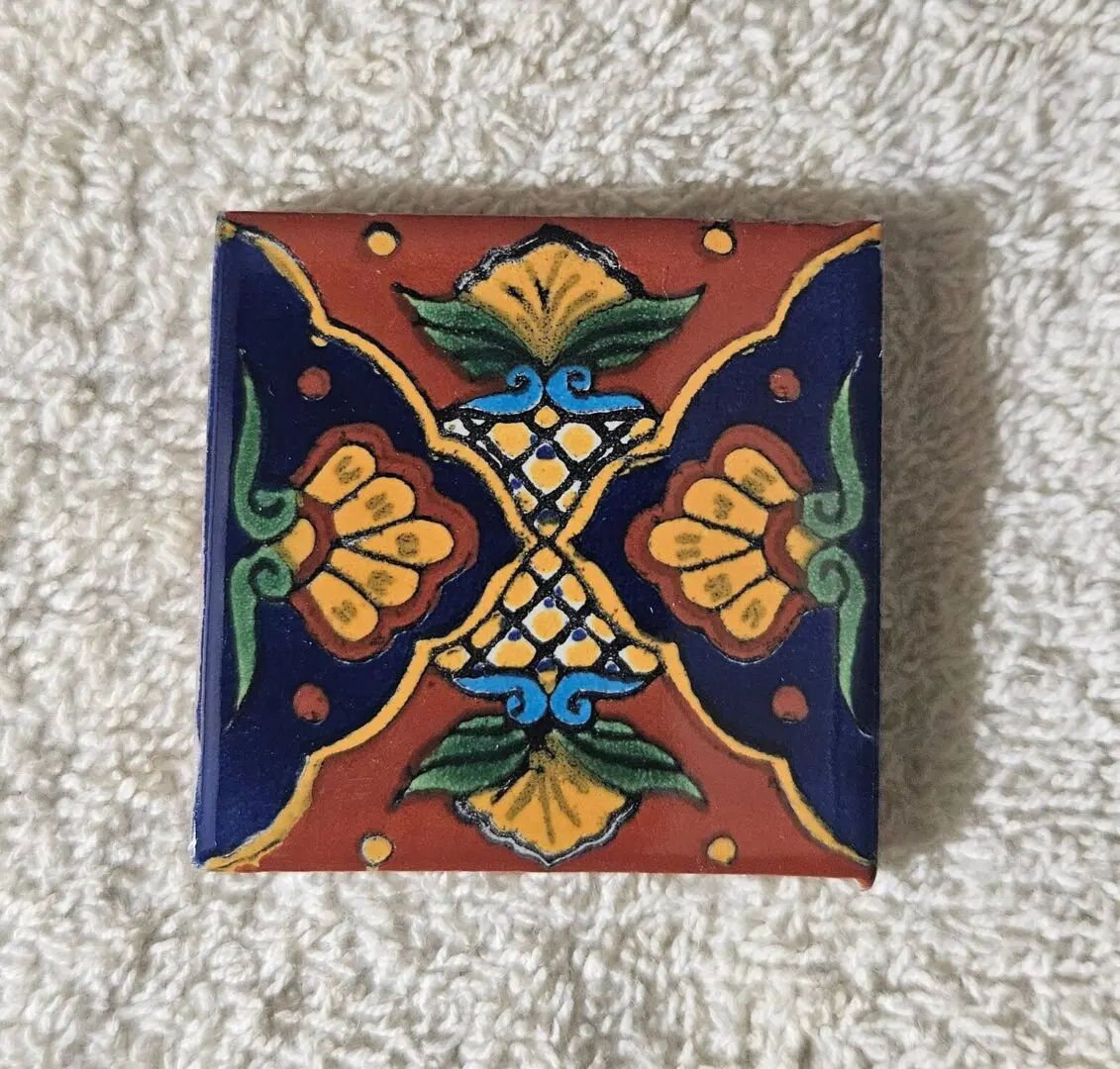 Colorful symmetrical hand-painted ceramic tile