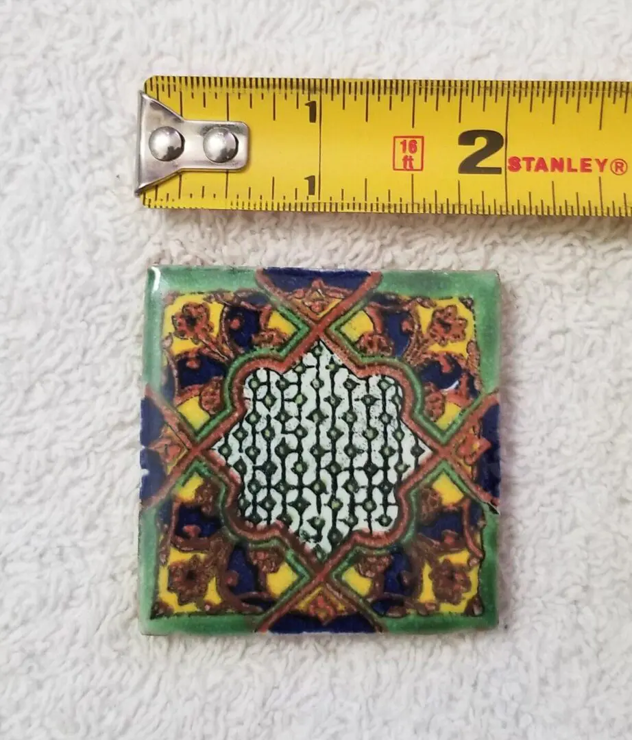 Colorful ornate two-inch decorative ceramic tile