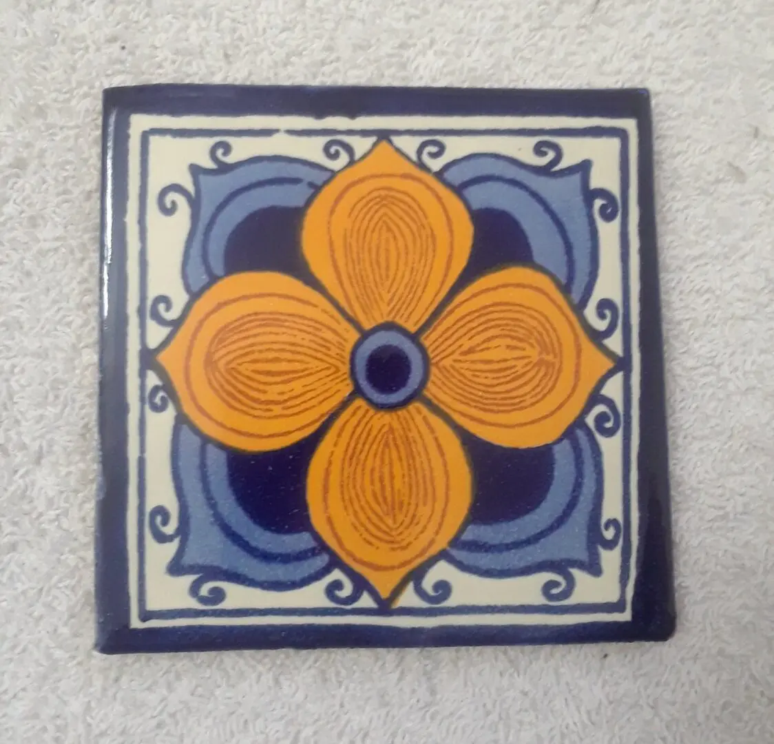 Colorful floral patterned ceramic tile design.