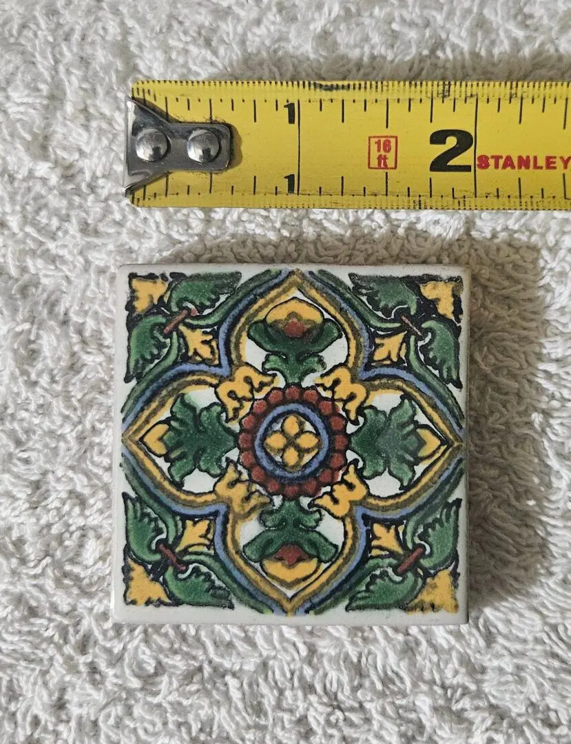 Decorative ceramic tile with colorful floral pattern