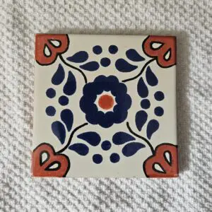 Square ceramic tile with blue floral pattern
