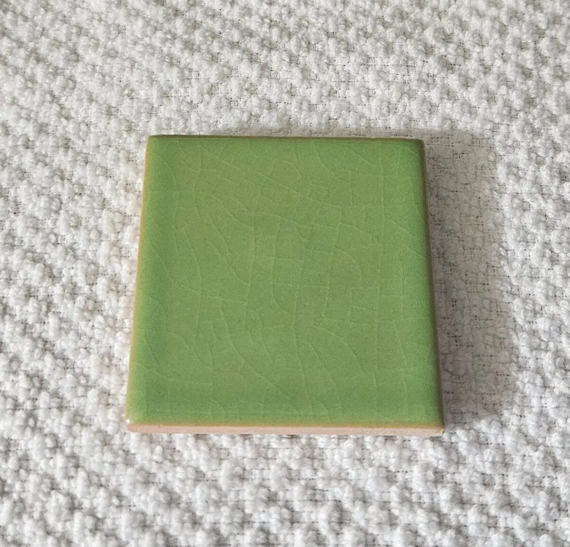 Square green ceramic tile swatch with crackle glaze