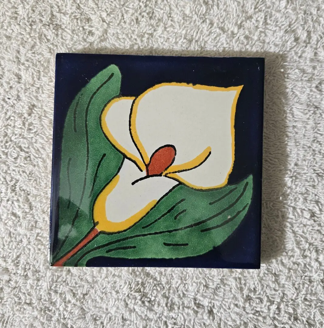 Hand-painted ceramic tile with calla lily