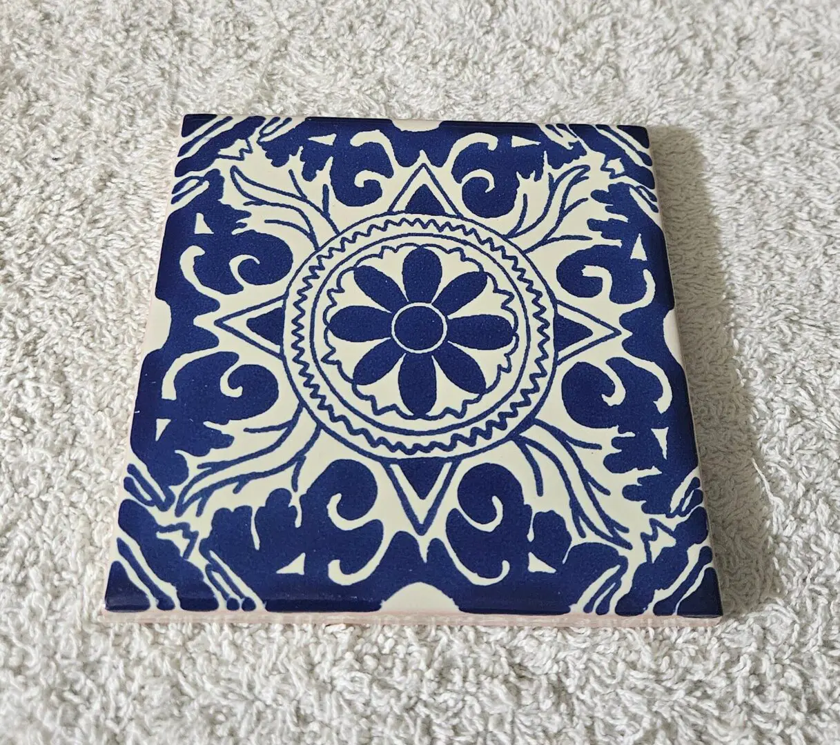 Blue and white decorative ceramic tile design.