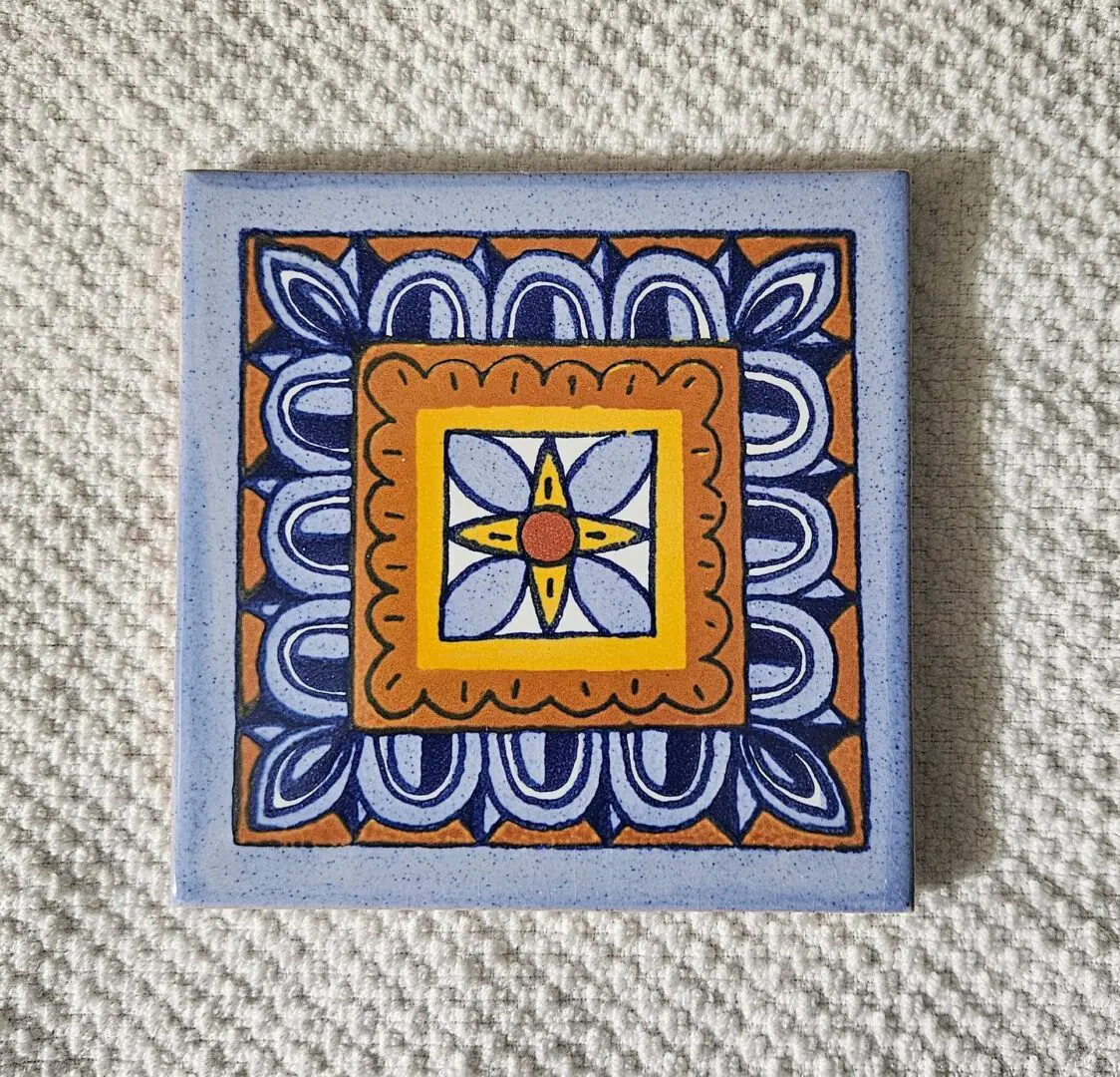 Colorful ceramic tile with geometric pattern.