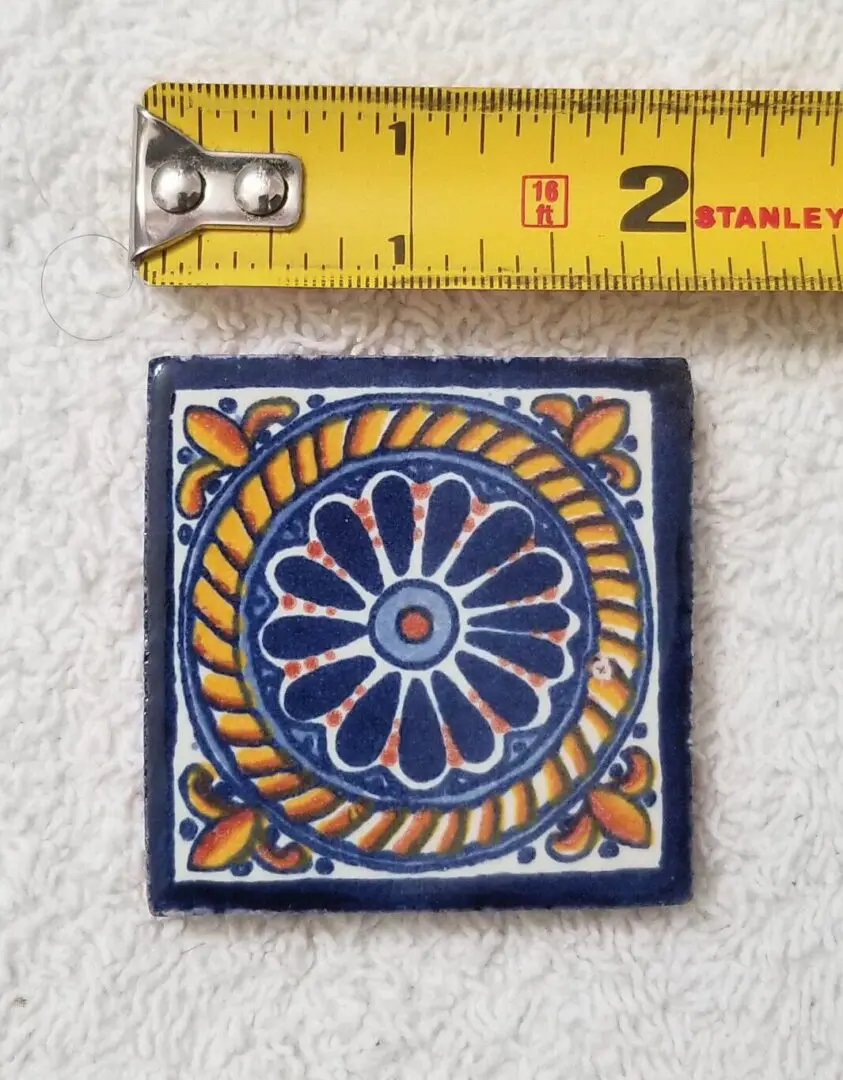 2-inch hand-painted blue and yellow tile