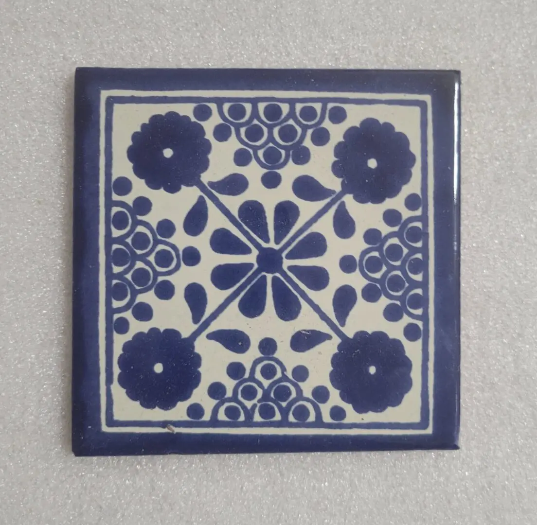 Blue and white floral patterned ceramic tile.