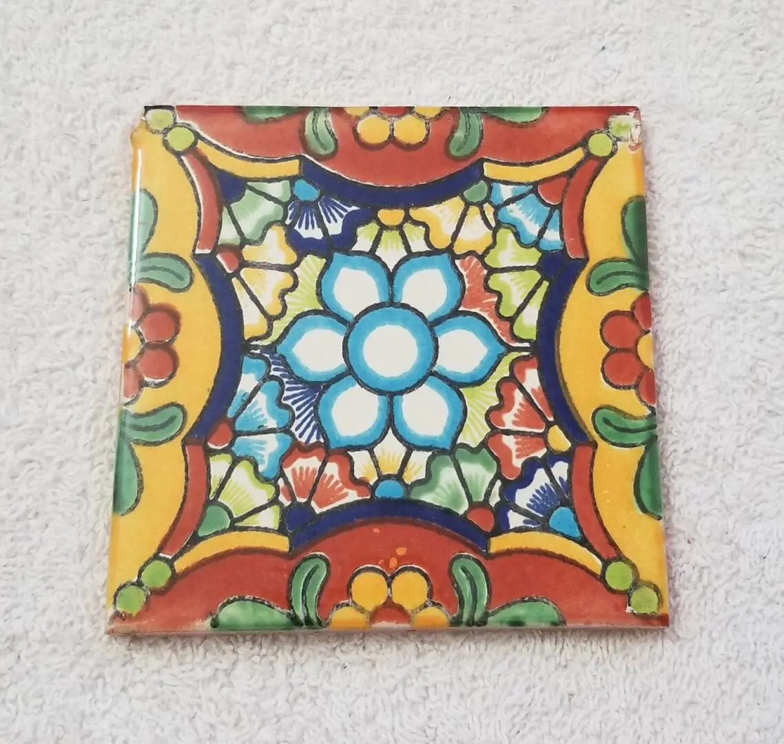 Colorful floral-patterned decorative ceramic tile.
