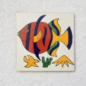 Colorful fish design on ceramic tile.