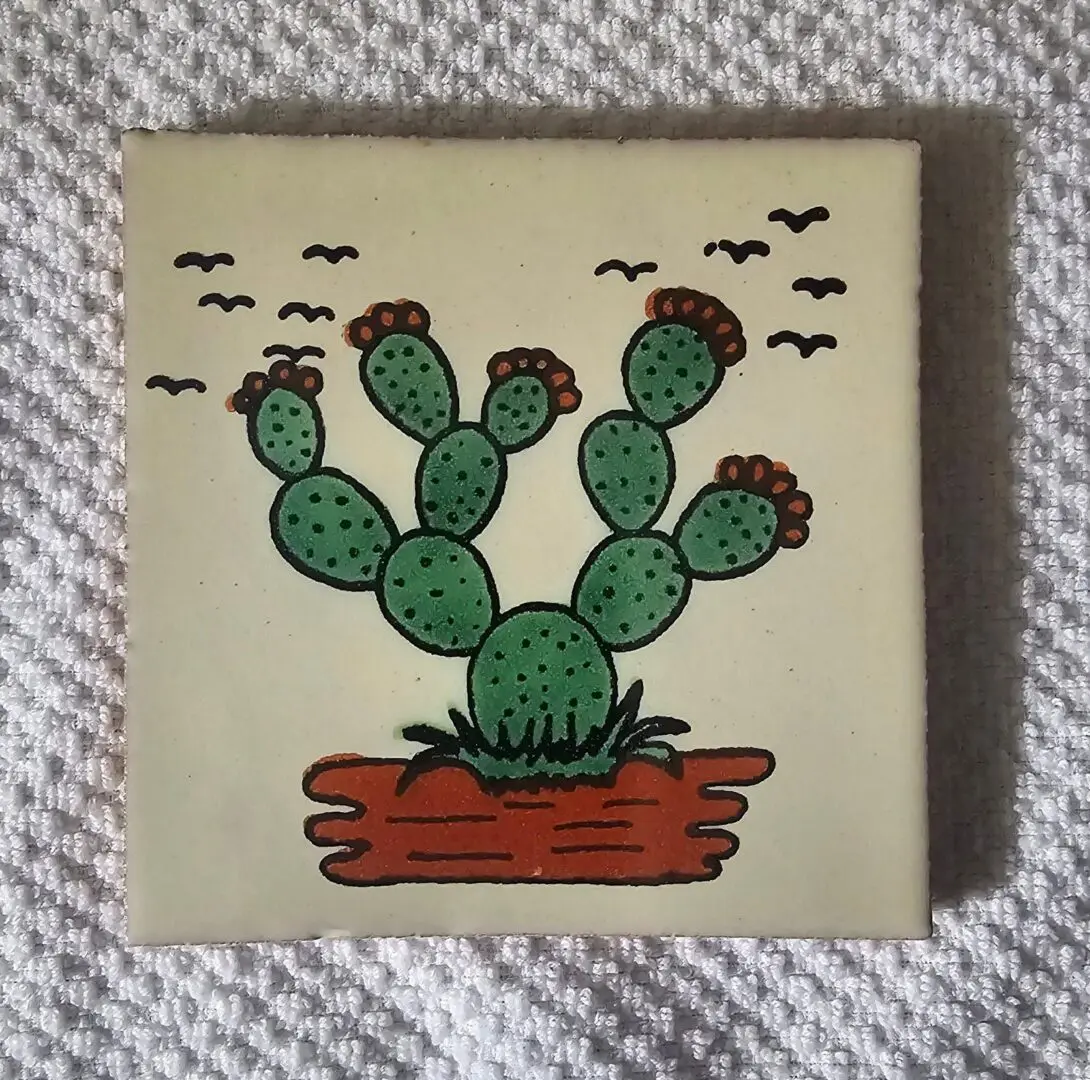 Tile with cactus and birds illustration.