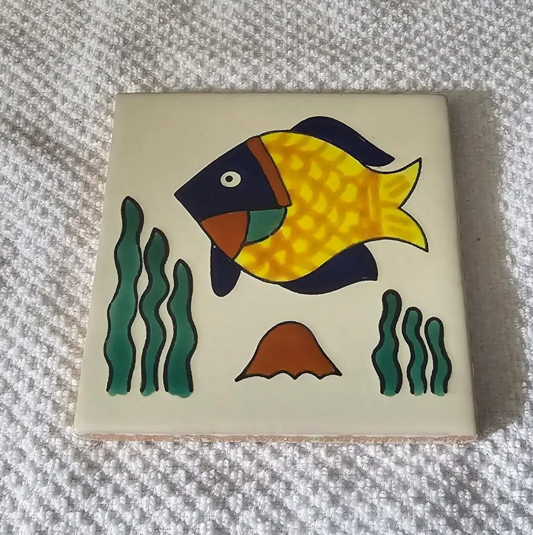 Decorative ceramic tile with colorful fish