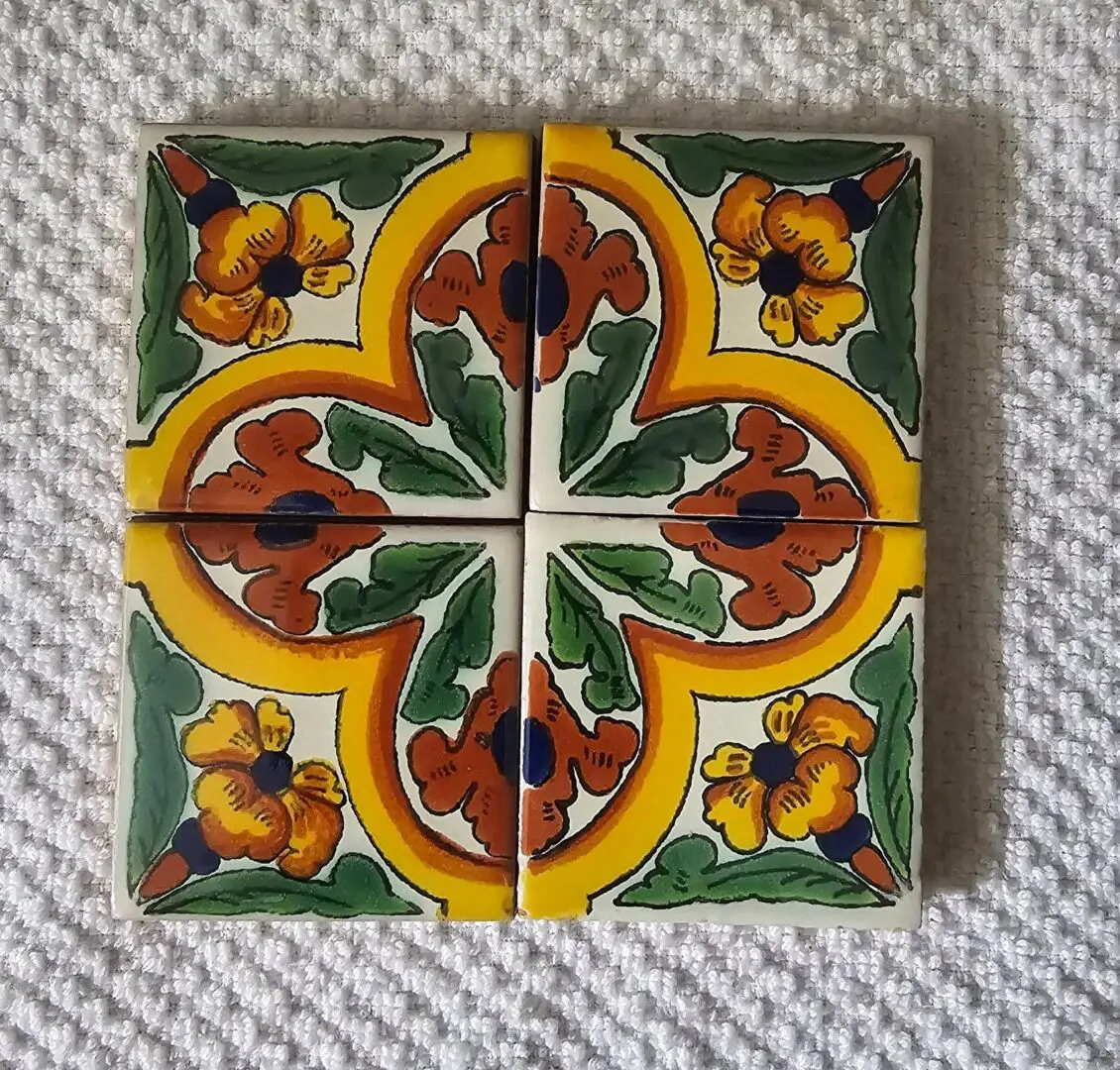 Colorful floral ceramic tiles with intricate design.