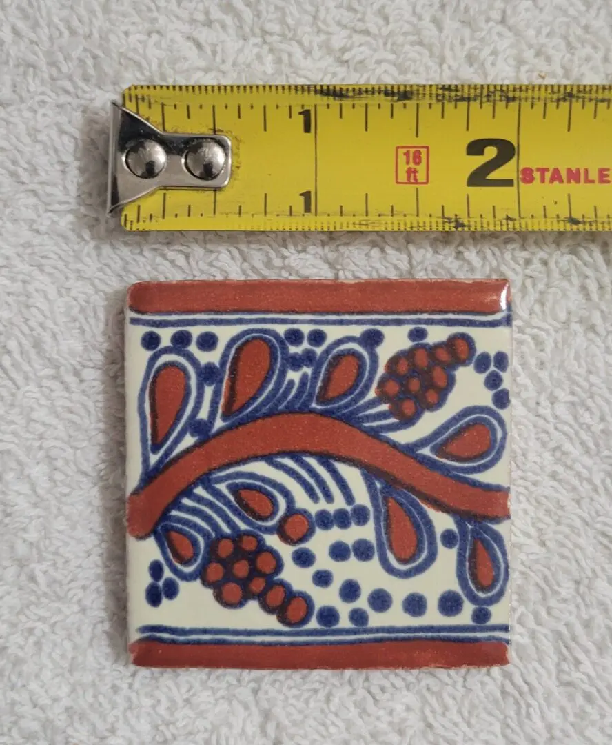 Square ceramic tile, red and blue floral motif