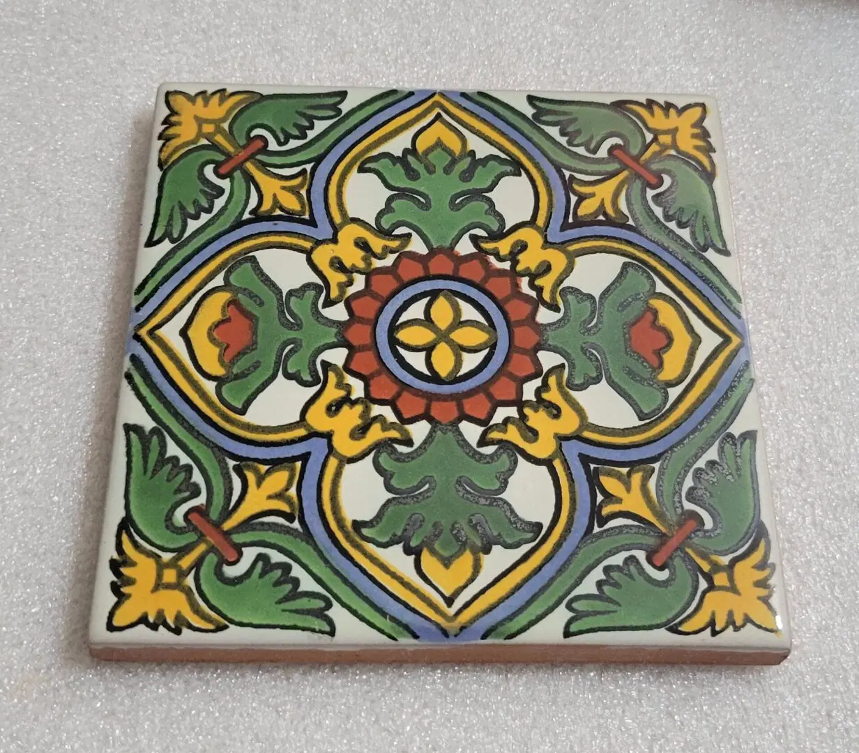 Colorful hand-painted ceramic tile with floral pattern