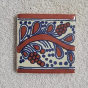 Decorative ceramic tile with colorful floral design.