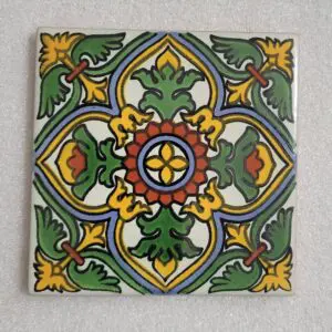 Colorful geometric patterned tile with floral motifs.