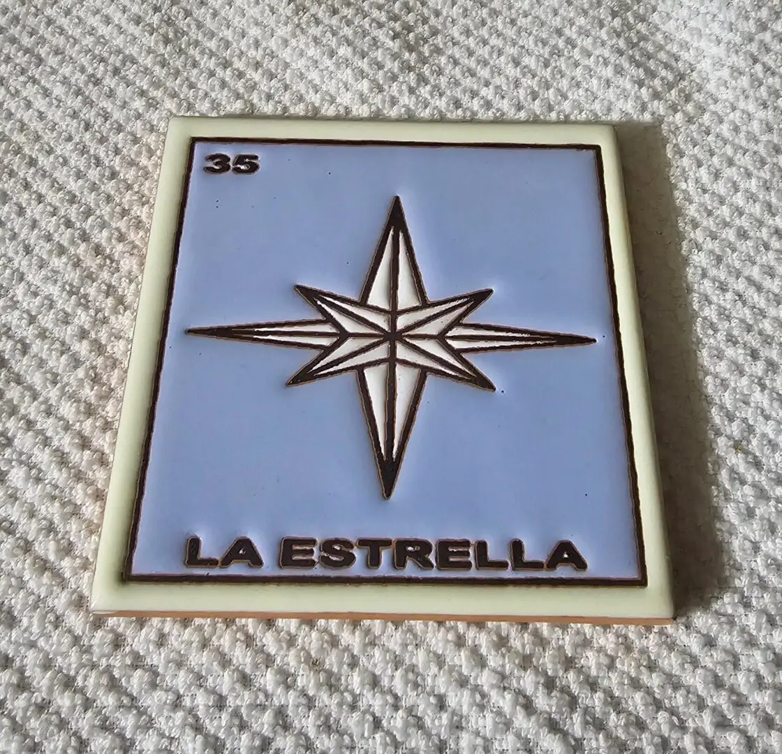 Blue and white tile with star design.