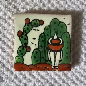 Ceramic tile with abstract cactus design.