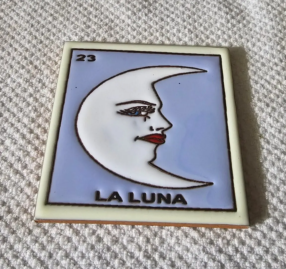La Luna tile with moon illustration.