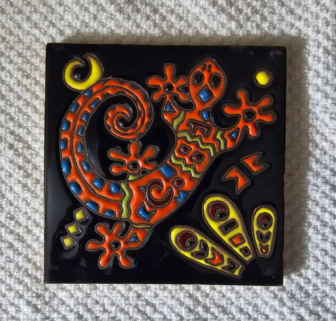 Colorful abstract lizard design on textured background.