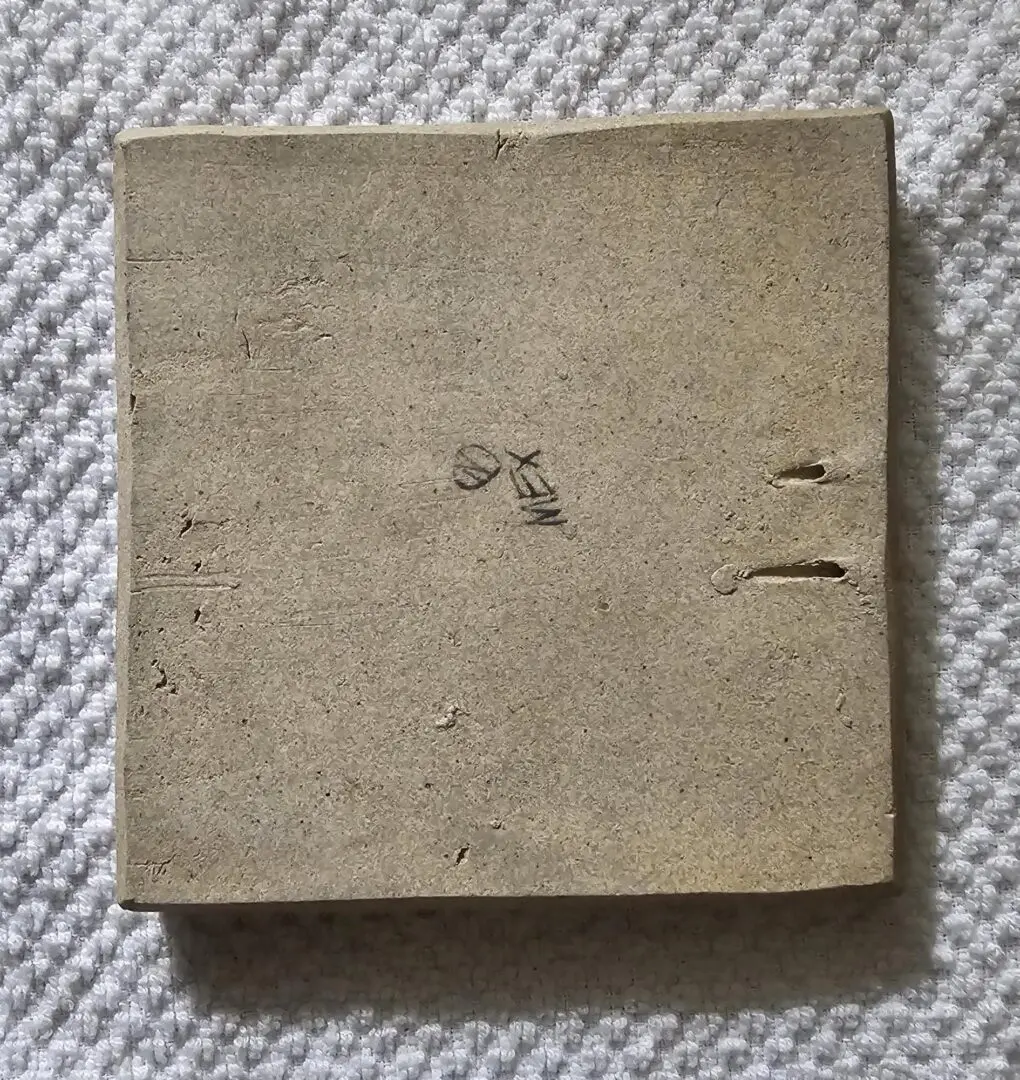 Old, worn book with a faded cover and torn edges.