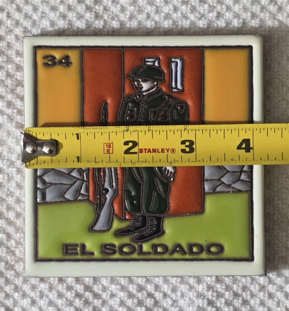 Tile with soldier and measuring tape.
