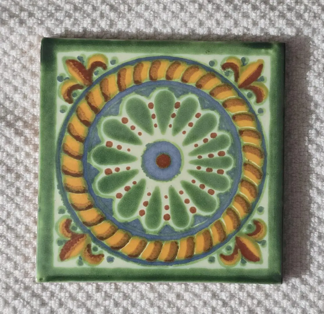 Hand-painted green floral ceramic tile