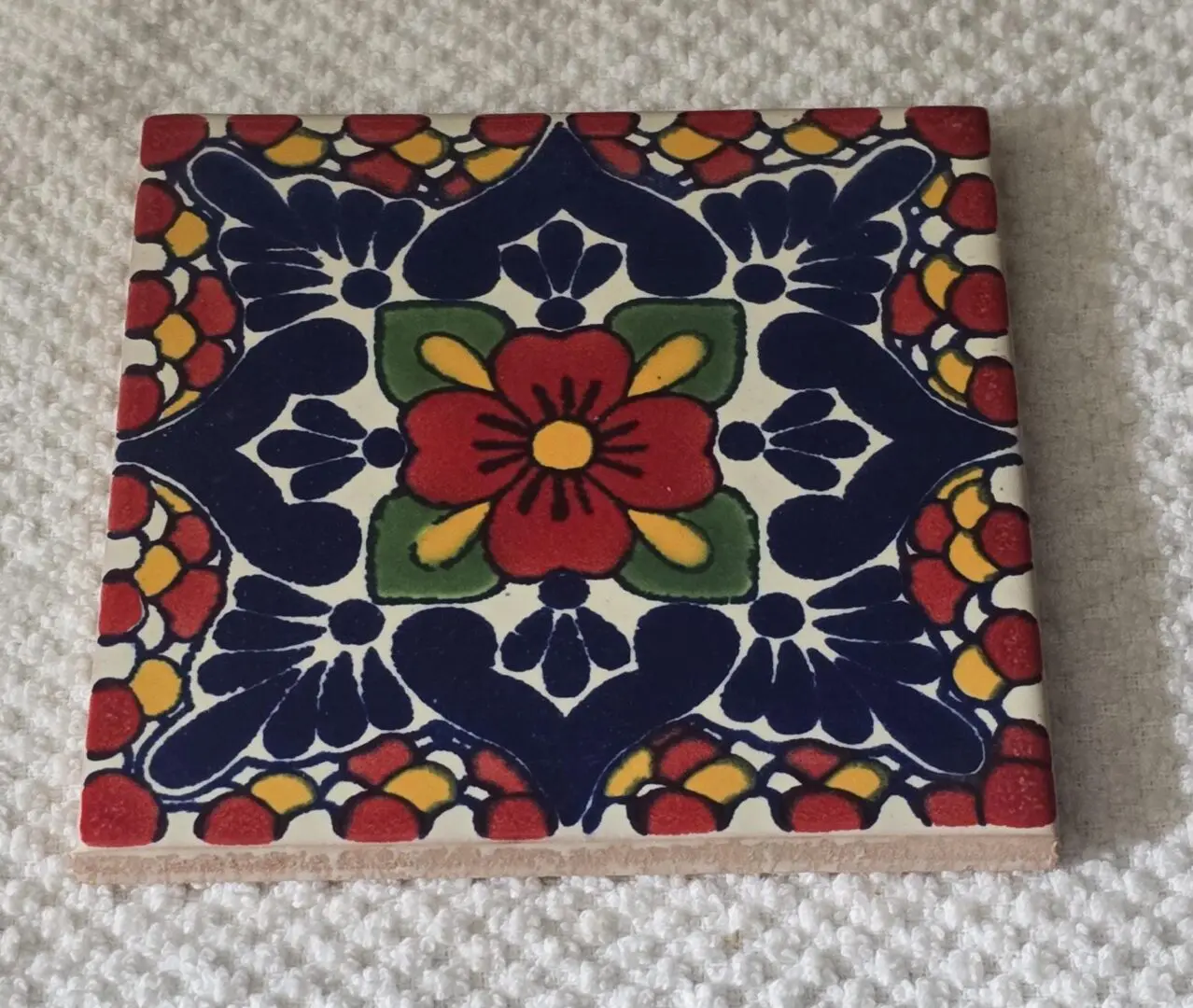 Colorful floral Talavera-style ceramic tile