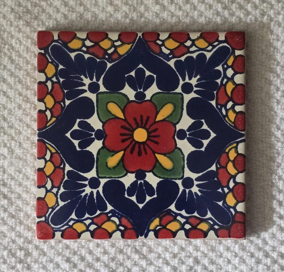 Colorful floral tile with intricate patterns.