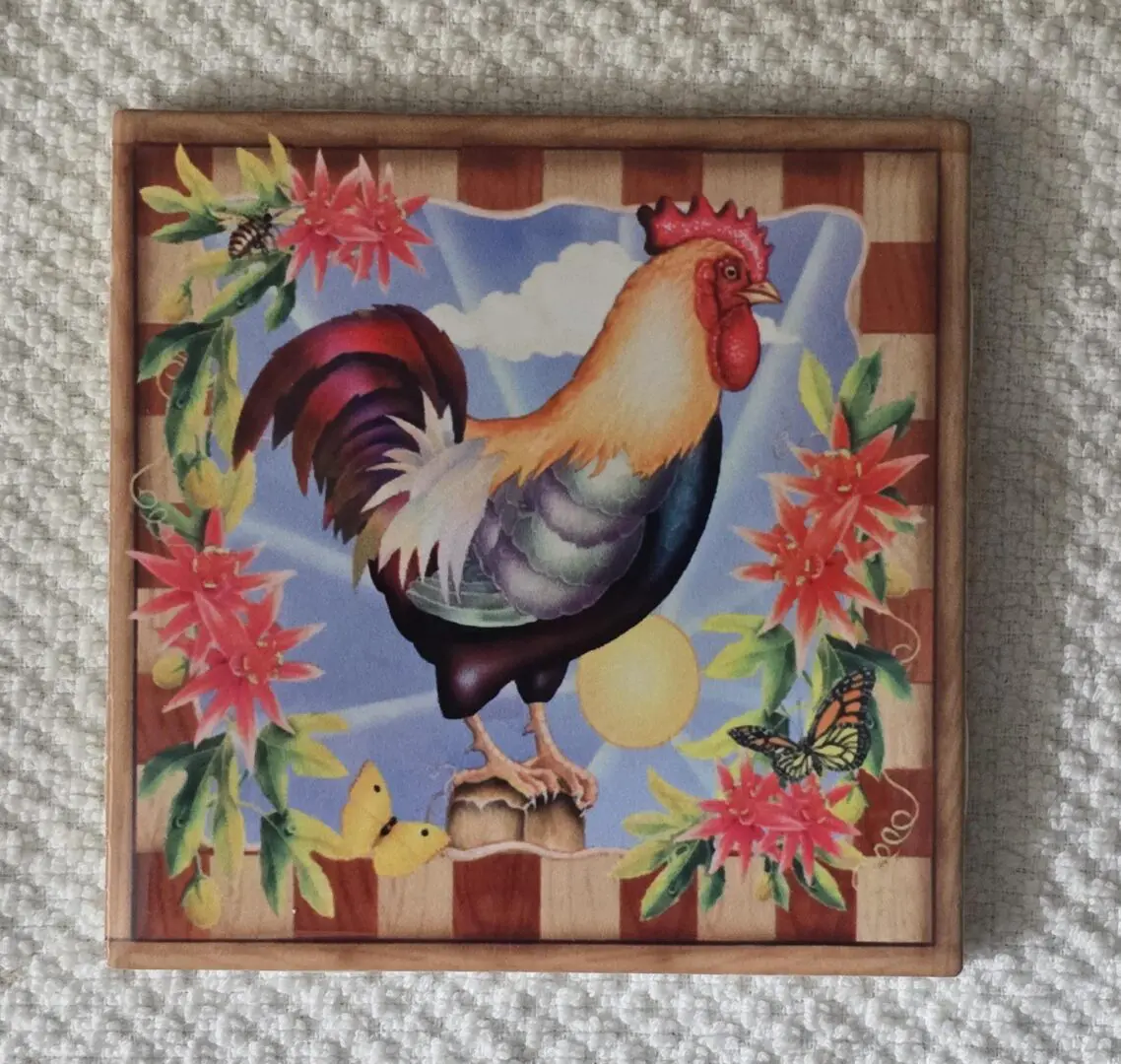 Colorful rooster surrounded by flowers and butterflies.