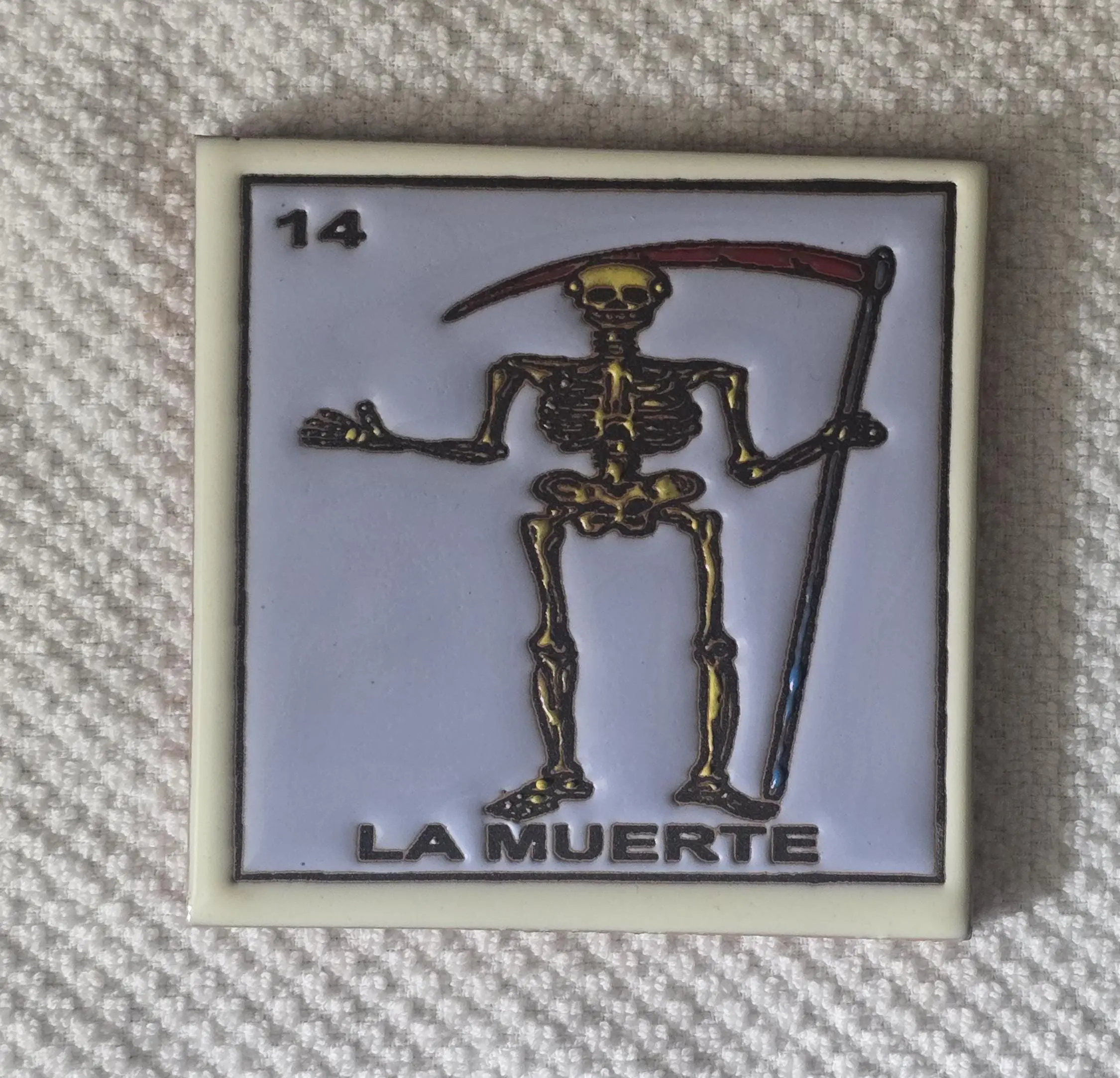 La Muerte card with skeleton and scythe.