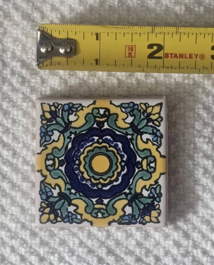 2-inch decorative ceramic tile with floral pattern