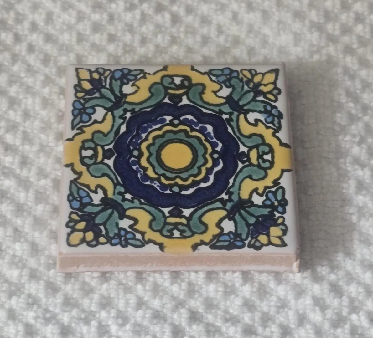 Decorative ceramic tile with floral medallion