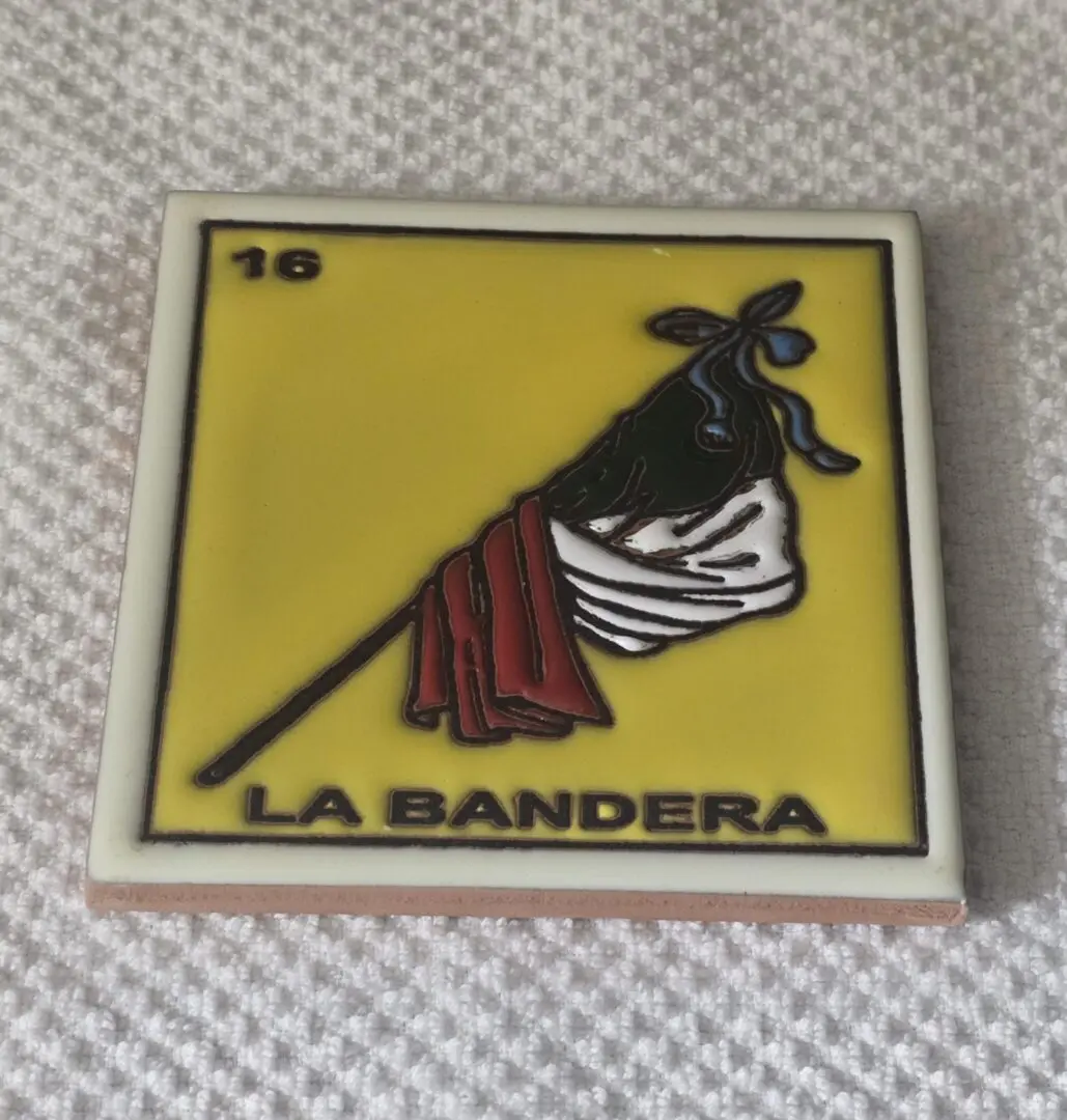 Yellow tile with flag design, "La Bandera.