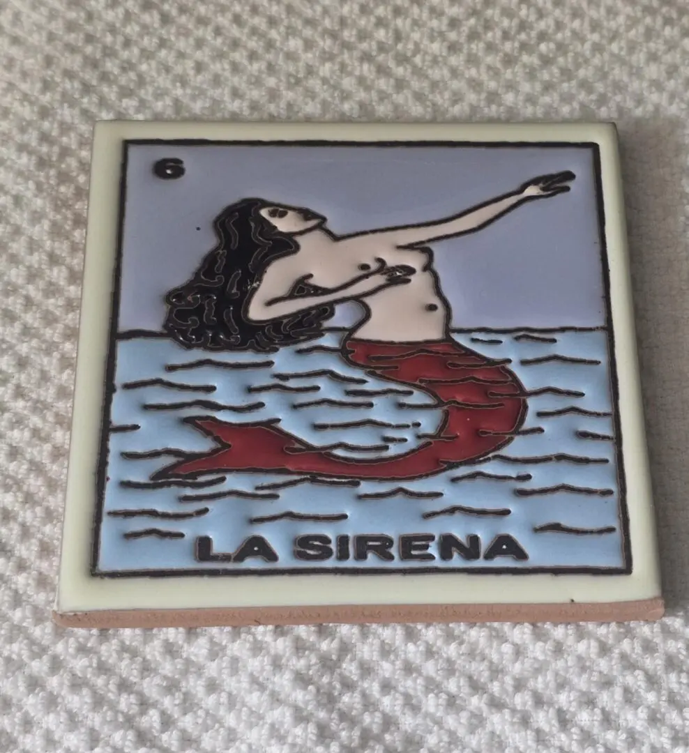 Mermaid illustration on decorative tile, "La Sirena".