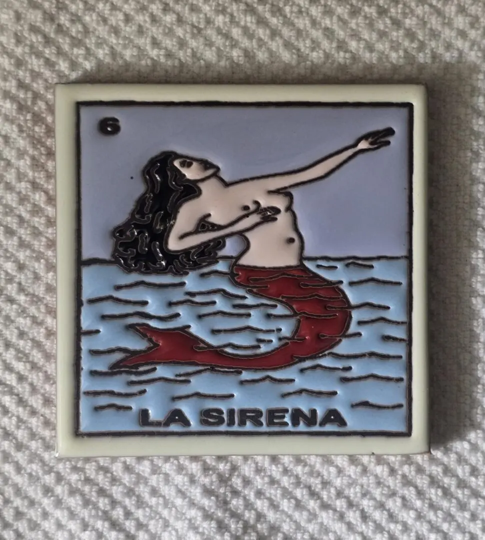 Mermaid illustration labeled "La Sirena" on card.